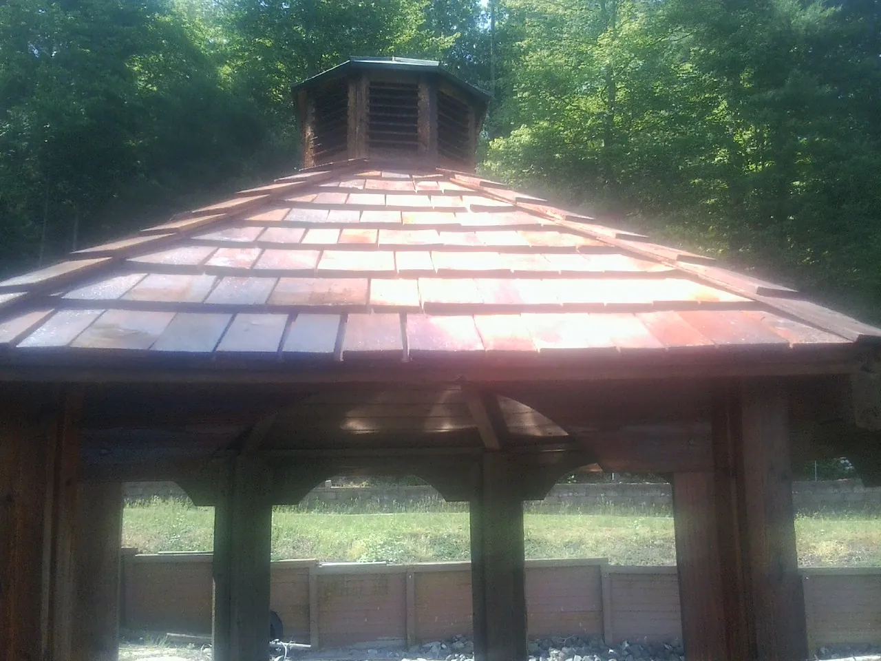 New cedar shake roof and cupola on a lakeside gazebo in Jones Mills